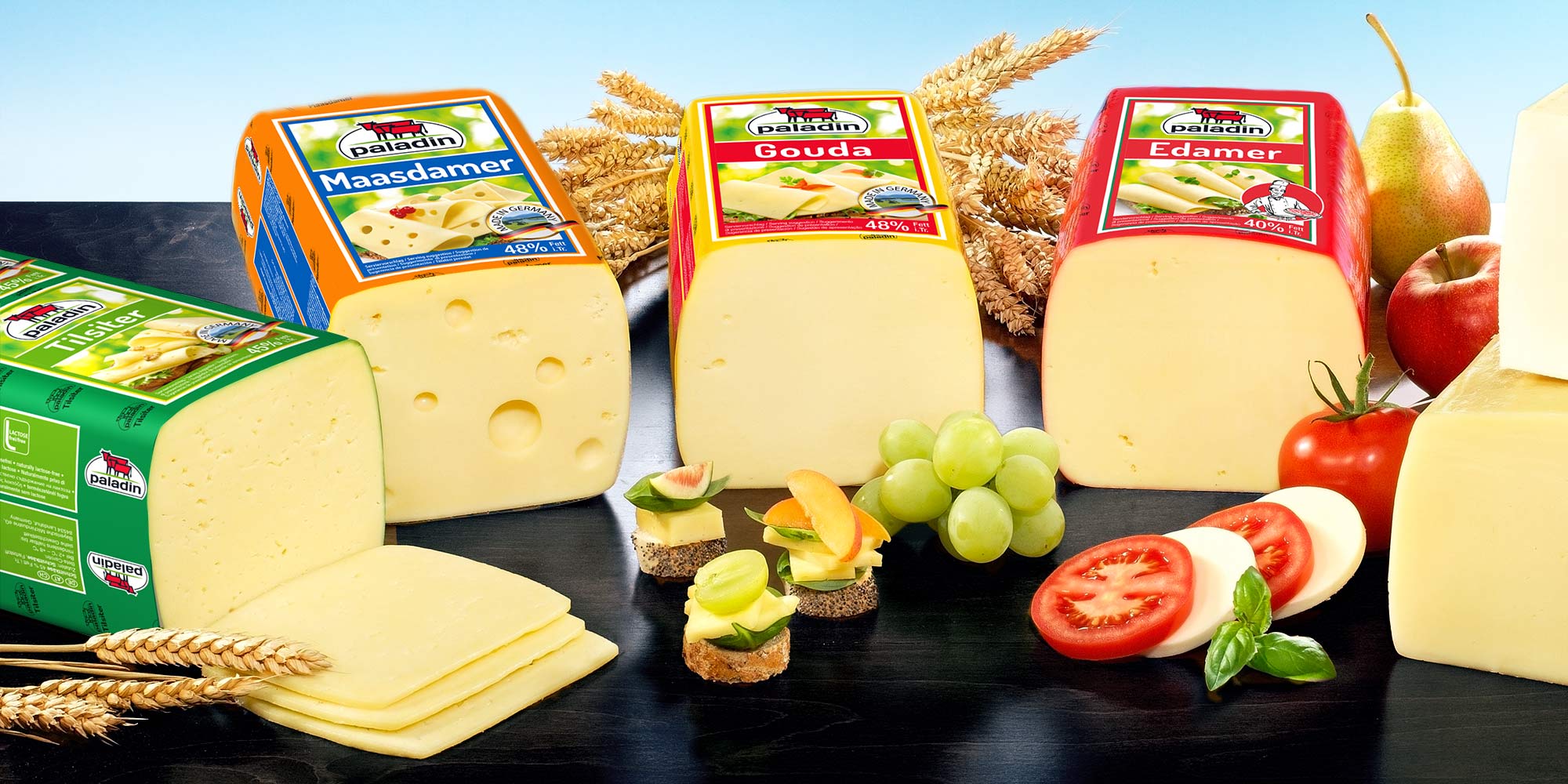 Paladin Schnittkäse-Brote in Tilsiter, Maasdamer, Gouda und Edamer mit Obst und Ähren